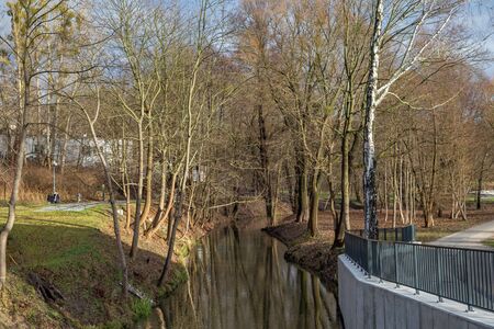 OLSZTYN, POLAND - DECEMBER 31, 2018: View of the Lyna river in the Park Centralny in Olsztyn. The park has an area of ââabout 13 ha. His space was designed in the English style.のeditorial素材