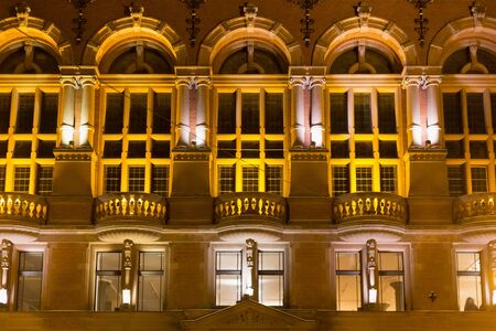 TORUN, POLAND - JANUARY 08, 2016: Night view of the windows of the Artus Court. The building was designed by Rudolph Schmidt in neo-renaissance and historicism styles and built between 1889 and 1891.のeditorial素材