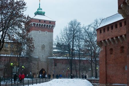 KRAKOW, POLAND - JANUARY 06, 2016: Winter view of the St. Florian Gate.  The Gate is one of the...