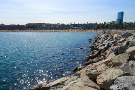 BARCELONA, SPAIN - MAY 15, 2017: View of the Mediterranean coast in Barcelona with city buildings on the background.のeditorial素材