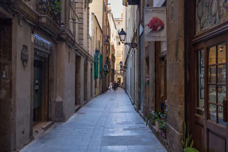 BARCELONA, SPAIN - MAY 15, 2017: View of the old historical narrow street Carrer de Verdaguer i Callis near famous Gothic quarter in center of Barcelona.のeditorial素材