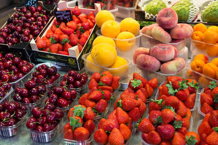 BARCELONA, SPAIN - MAY 16, 2017: Selling fresh fruits on the famous market La Boqueria in Barcelona.のeditorial素材