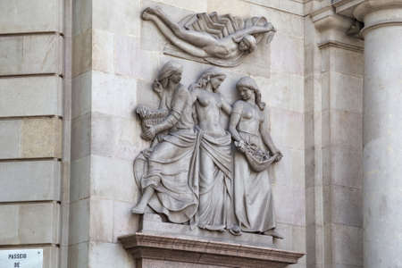 BARCELONA, SPAIN - MAY 16, 2017: Sculptures with women in the facade of Embassy of Argentina building. The building is one of the first Barcelona skyscrapers.のeditorial素材