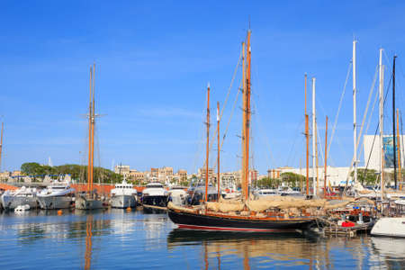 BARCELONA, SPAIN - MAY 16, 2017: View of the sailboats on the pier in center of Barcelona in sunny...