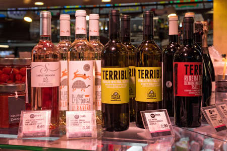 BARCELONA, SPAIN - MAY 16, 2017: Sale of the wine  on the famous La Boqueria market in Barcelona.のeditorial素材