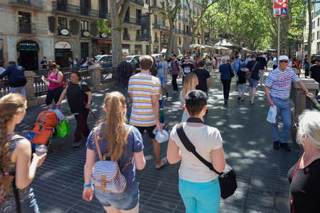 BARCELONA, SPAIN - MAY 15, 2017: Unknown people walking on the famous La Rambla street in center of Barcelona.のeditorial素材