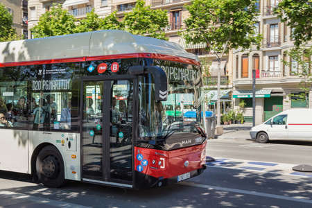 BARCELONA, SPAIN - MAY 15, 2017: View of the municipal public bus in center of Barcelona in sunny day.のeditorial素材
