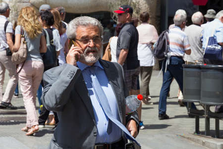 BARCELONA, SPAIN - MAY 16, 2017: Unknown man walking in center of Barcelona on Passeig de Gracia street.のeditorial素材