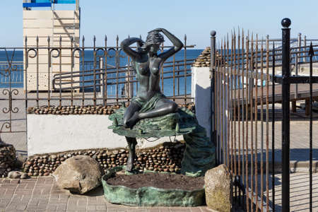 ZELENOGRADSK, KALININGRAD REGION, RUSSIA - APRIL 02, 2019: Sculpture of a naked woman on the Baltic Sea coast in famous resort Zelenogradsk (formerly known as Cranz) at spring time.のeditorial素材