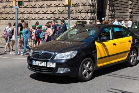 BARCELONA, SPAIN - MAY 16, 2017: View of the public taxi car in center of Barcelona in sunny day.のeditorial素材