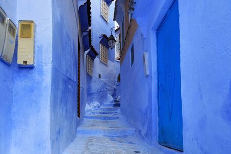 View of the blue walls of Medina quarter in Chefchaouen, Morocco. The city, also known as Chaouen is noted for its buildings in shades of blue and that makes Chefchaouen very attractive to visitors.の写真素材