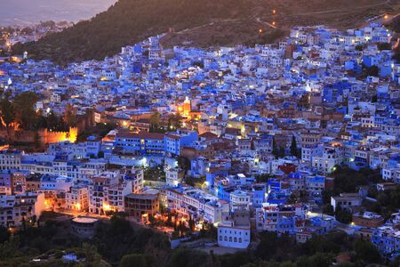 Aerial evening view of Chefchaouen in Morocco. The city is noted for its buildings in shades of blue and that makes Chefchaouen very attractive to visitors.の写真素材