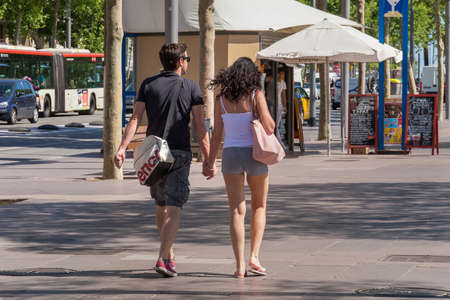 BARCELONA, SPAIN - MAY 15, 2017: Unknown tourists walking on the Passeig de Joan de Borbo street in...