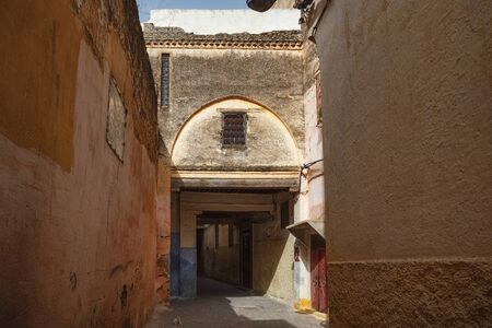 Old gate in Meknes medina. Meknes is one of the four Imperial cities of Morocco and the sixth...
