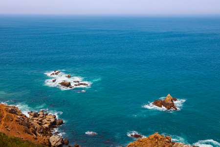 View of the stone islets near the Atlantic Ocean coast in Morocco in sunny day.
