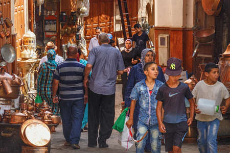 FEZ, MOROCCO - MAY 31, 2017: Unknown people in market in medina quarter of Fez. The medina of Fez is...