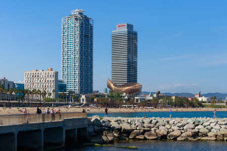 BARCELONA, SPAIN - MAY 15, 2017: View of the city beach in Barcelona on the Mediterranean sea. With view to the modern skyskrapers and blue sky.のeditorial素材