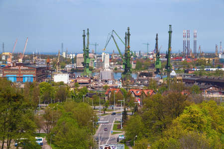 GDANSK, POLAND - MAY 14, 2017: Harbor cranes at the Stocznia Gdanska (famous shipyard of Gdansk) on a sunny day.のeditorial素材
