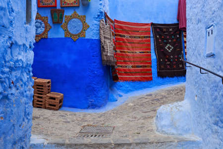 View of the blue walls of Medina quarter in Chefchaouen, Morocco. The city, also known as Chaouen is noted for its buildings in shades of blue and that makes Chefchaouen very attractive to visitors.の写真素材