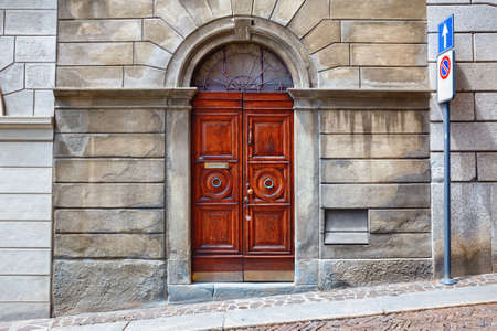 View of the historical wooden door in Bergamo in northern Italy. Bergamo is a city in the alpine Lombardy region.の写真素材