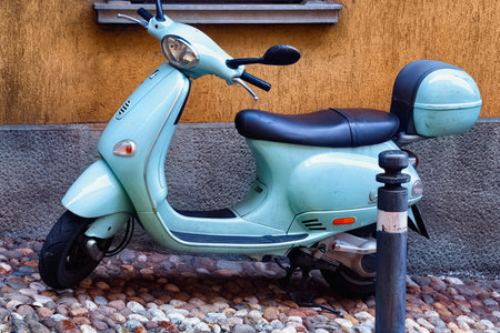 BERGAMO, ITALY - MAY 22, 2019: Blue popular Italian scooter Vespa on the street in Bergamo.のeditorial素材