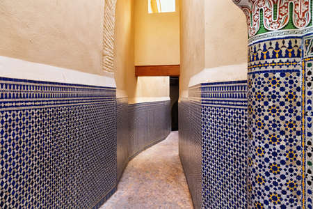 View of the narrow streets of Fez Medina quarter in Morocco. A medina is typically walled, with many...