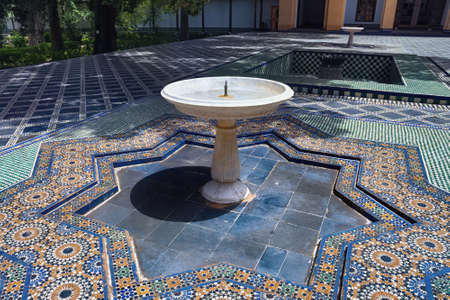 FEZ, MOROCCO - JUNE 02, 2017: Fountain in the Dar Batha. The former royal palace, was built by the...