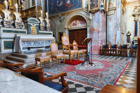 BERGAMO, ITALY - MAY 22, 2019: Chairs near the main altar in the Catholic Church of Sant Agata nel Carmine in Bergamo.のeditorial素材