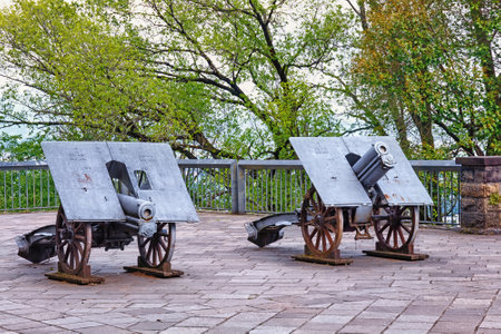 BERGAMO, ITALY - MAY 22, 2019: Old cannon weapon in the park of the Fortress of Bergamo (Rocca di Bergamo). The Museum at the Rocca di Bergamo is part of the Bergamo History Museum.のeditorial素材