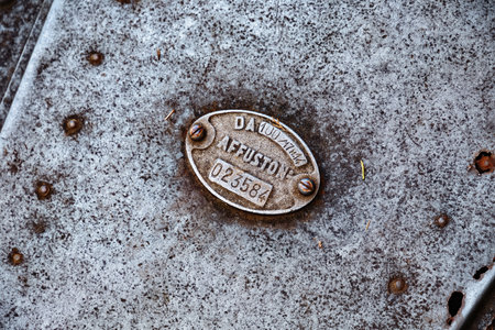 BERGAMO, ITALY - MAY 22, 2019: Serial number on the old cannon weapon (Obice da 100-17, M. 14, Skoda, 1914) in the park of the Fortress of Bergamo.のeditorial素材
