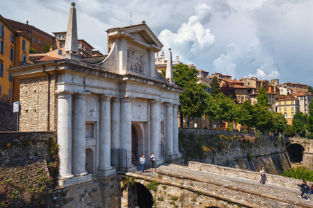 BERGAMO, ITALY - MAY 22, 2019: View of the Porta San Giacomo gate in Bergamo. Its gate, leading through the Venetian walls to the upper city of Bergamo, was built in 1592 from pinkish-white marble.のeditorial素材