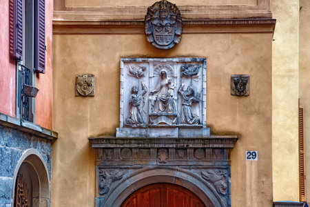 BERGAMO, ITALY - MAY 22, 2019: Bas-relief above the entrance to one of the historic buildings in Upper Bergamo (Citta Alta).のeditorial素材