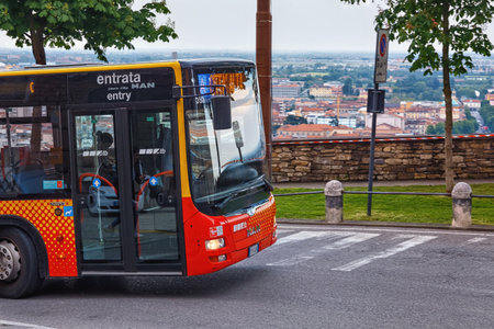 BERGAMO, ITALY - MAY 22, 2019: Public Bergamo bus climbing up the road to the Upper Town (Citta Alta).のeditorial素材