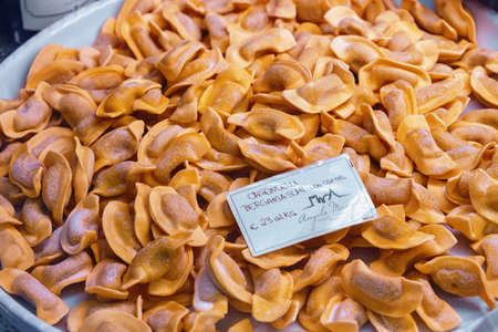 BERGAMO, ITALY - MAY 22, 2019: Showcase with casoncelli in Bergamo. Casoncelli are kind of stuffed pasta, typical of the culinary tradition of Lombardy, in the north-central part of Italy.のeditorial素材
