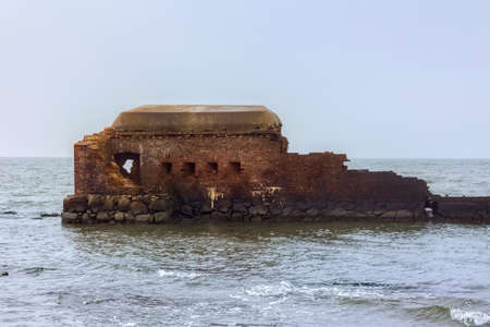 Ruins of the Western Fort on the Baltic Sea coast of the Vistula Spit. The Fort was built in 1869-1871, as part of the complex of fortifications of the Pillau fortress city (now known as Baltiysk).の写真素材