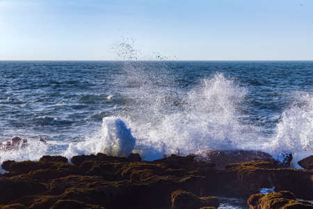 View of the waves of the Atlantic Ocean in the area of the city of Essaouira in Morocco on a sunny...