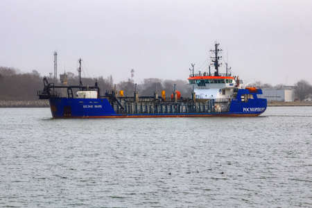BALTIYSK, RUSSIA - JANUARY 02, 2021: Dredging ship by name White Sea (project Damen TSHD2000) in the Vistula Lagoon. The ship was built in 2018 in Damen Yichang Shipyard, China.のeditorial素材