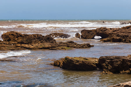 Volcanic coast of the Atlantic ocean in the Essaouira on a sunny summer day. Morocco.の写真素材