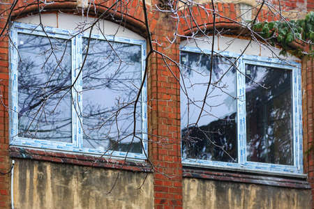 GVARDEYSK, RUSSIA - DECEMBER 14, 2013: New-framed windows of an old brick historic building in Gvardeysk (formerly the German city of Tapiau in East Prussia).のeditorial素材