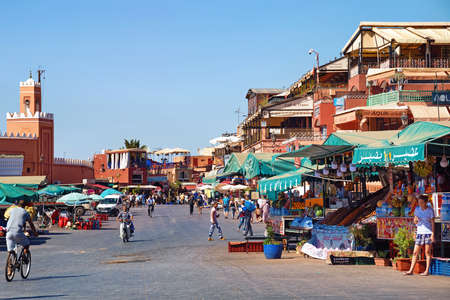 MARRAKESH, MOROCCO - JUNE 05, 2017: View of the market on the famous Jemaa el-Fnaa in the medina of Marrakesh on a sunny day.のeditorial素材
