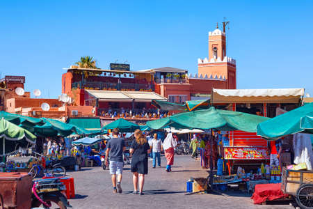 MARRAKESH, MOROCCO - JUNE 05, 2017: View of the market on the famous Jemaa el-Fnaa in the medina of Marrakesh on a sunny day.のeditorial素材