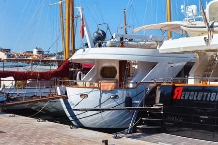 CANNES, FRANCE - JUNE 19, 2017: View of the some of the luxury yachts moored in the port of Cannes.のeditorial素材