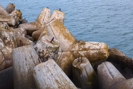 Massive concrete breakwaters to protect the coast from the destructive effects of sea waves.の写真素材