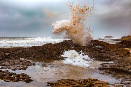 View of the wave splash on the Atlantic Ocean coast in the area of Essaouira in Morocco.の写真素材