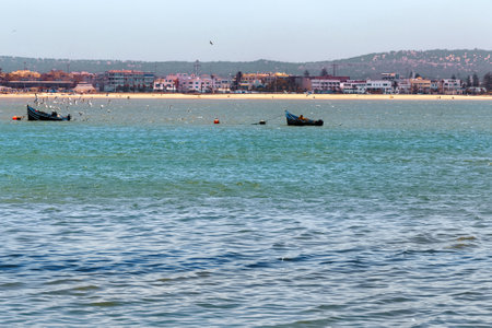 Fishing boats near the shore of the Essaouira on a sunny summer day. Morocco.の写真素材