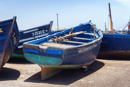ESSAOUIRA, MOROCCO - JUNE 09, 2017: Fishing wooden blue boats moored in the harbor of the Essaouira.