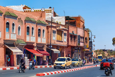 MARRAKESH, MOROCCO - JUNE 05, 2017: View of the red walls historical buildings near the medina of Marrakesh on a sunny day.のeditorial素材