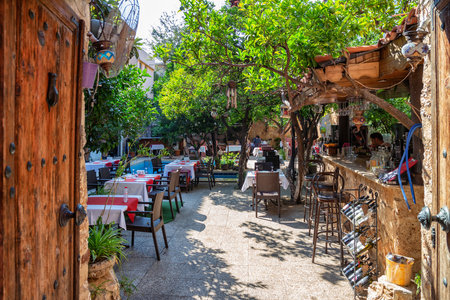 ANTALYA, TURKEY - JULY 08, 2018: One of the open air cafes in Kaleici (it is popular old historical quarter in Antalya).のeditorial素材