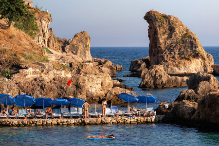 ANTALYA, TURKEY - JULY 08, 2018: Unknown people resting on the famous Mermerli beach in Antalya.のeditorial素材