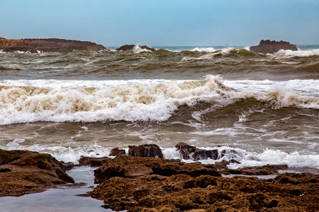 View of the volcanic shore of the Atlantic Ocean in the area of Essaouira in Morocco.の写真素材